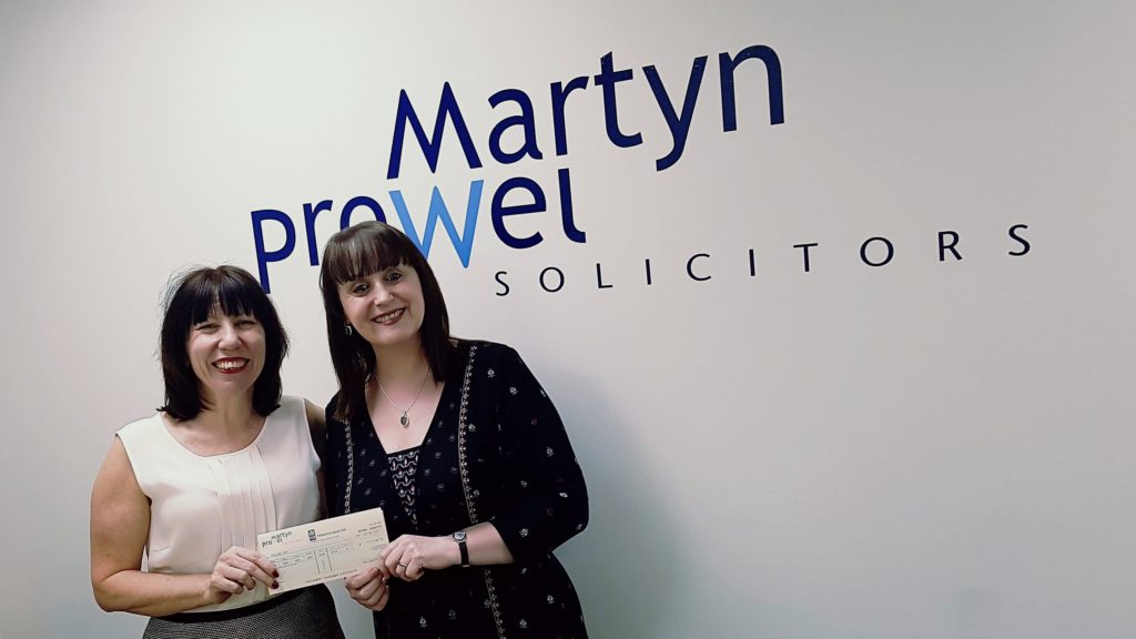 Caron Rockey presents cheque to Bullies Out